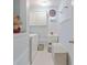 Compact laundry room featuring a utility sink, washer, dryer, and storage cabinets, perfect for household tasks at 7523 Kimberly Lynn Ct, Lithonia, GA 30058