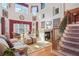 Bright living room with fireplace, large windows, and elegant decor at 7523 Kimberly Lynn Ct, Lithonia, GA 30058