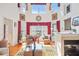 Living room features large windows, fireplace, and hardwood floors at 7523 Kimberly Lynn Ct, Lithonia, GA 30058