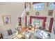 Spacious living room with a hardwood floor and many windows showing a lush outdoor view at 7523 Kimberly Lynn Ct, Lithonia, GA 30058