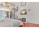 Main bedroom with fireplace, spiral staircase, and upstairs loft at 7523 Kimberly Lynn Ct, Lithonia, GA 30058