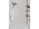 Shower with tile surround and corner shelving at 7523 Kimberly Lynn Ct, Lithonia, GA 30058