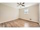 This bedroom features wood-look floors, neutral walls and a large window providing great natural light at 840 Wells Se Cir, Smyrna, GA 30080