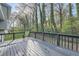 Back deck showing the treed backyard and scenic outdoors; relax and unwind on this deck with a view at 840 Wells Se Cir, Smyrna, GA 30080