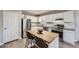 Modern kitchen with white cabinets, granite counters, stainless appliances and a butcher block island at 840 Wells Se Cir, Smyrna, GA 30080