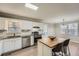 Modern kitchen with stainless appliances, white cabinets, granite counters, and a cozy breakfast bar at 840 Wells Se Cir, Smyrna, GA 30080
