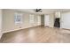 Expansive living room featuring beautiful laminate floors, two bright windows, and neutral colored walls at 840 Wells Se Cir, Smyrna, GA 30080