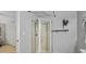 Bathroom showcasing a corner shower with glass doors, and modern fixtures at 1311 Sylvan Cir, Brookhaven, GA 30319