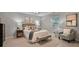 Comfortable bedroom featuring a well-dressed queen bed, soft chair, and natural light at 1311 Sylvan Cir, Brookhaven, GA 30319