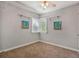 Cozy bedroom with carpet flooring and neutral walls, brightened by natural light at 1311 Sylvan Cir, Brookhaven, GA 30319