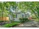 Quaint home exterior featuring a well-maintained lawn and lush greenery, creating a private and inviting atmosphere at 1311 Sylvan Cir, Brookhaven, GA 30319
