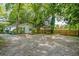 Charming home showcasing ample parking space and a well-kept exterior, complete with a lovely blue front door at 1311 Sylvan Cir, Brookhaven, GA 30319