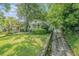 Charming bungalow with a covered front porch and mature landscaping at 1311 Sylvan Cir, Brookhaven, GA 30319