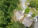 Aerial view of a well-maintained property featuring lush landscaping and a cozy outdoor space at 1537 Maplecliff Way, Sugar Hill, GA 30518