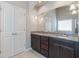 Bathroom featuring granite countertops, dual sinks, and ample lighting for daily routines at 1537 Maplecliff Way, Sugar Hill, GA 30518