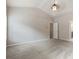 This carpeted bedroom has neutral colors and is enhanced by natural light from two windows at 1537 Maplecliff Way, Sugar Hill, GA 30518