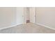 Neutral bedroom features a carpet, a light, and a closet to provide a cozy and functional space at 1537 Maplecliff Way, Sugar Hill, GA 30518