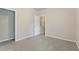 Neutral bedroom with carpeted floors and a spacious closet at 1537 Maplecliff Way, Sugar Hill, GA 30518