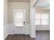 Welcoming foyer showcasing elegant trim work, wood flooring, and a bright, airy ambiance at 1537 Maplecliff Way, Sugar Hill, GA 30518
