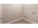 Practical laundry room with utility connections and easy access at 1537 Maplecliff Way, Sugar Hill, GA 30518
