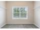 The walk-in closet offers built-in shelving and a window for organized storage and natural light at 1537 Maplecliff Way, Sugar Hill, GA 30518