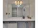 Modern bathroom with large mirror, vanity with gray cabinets, and stylish lighting at 1772 Brittany Chase Nw, Kennesaw, GA 30152
