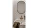 Bathroom featuring a pedestal sink and an oval mirror at 1772 Brittany Chase Nw, Kennesaw, GA 30152