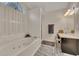 Bright bathroom with a large garden tub, shower, and vanity at 1772 Brittany Chase Nw, Kennesaw, GA 30152