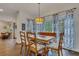 Dining room with natural wood table and views to living room at 1772 Brittany Chase Nw, Kennesaw, GA 30152
