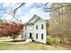 Charming two-story home boasts light green siding, black front door, and a landscaped yard at 1772 Brittany Chase Nw, Kennesaw, GA 30152
