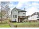 Exterior elevation showcasing deck and backyard at 1772 Brittany Chase Nw, Kennesaw, GA 30152