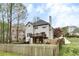 Exterior elevation showcasing deck and fenced backyard at 1772 Brittany Chase Nw, Kennesaw, GA 30152