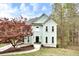 Charming two-story home features a black front door, manicured lawn, and beautiful landscaping at 1772 Brittany Chase Nw, Kennesaw, GA 30152