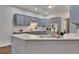 Kitchen island with a sink, gray cabinets, and white countertops at 1772 Brittany Chase Nw, Kennesaw, GA 30152