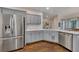 Kitchen featuring stainless steel appliances, gray cabinets and hardwood flooring at 1772 Brittany Chase Nw, Kennesaw, GA 30152
