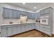 Spacious kitchen with gray cabinets, white countertops, and modern appliances at 1772 Brittany Chase Nw, Kennesaw, GA 30152
