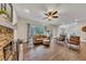 Spacious living room featuring hardwood floors, stone fireplace, and a view to other rooms at 1772 Brittany Chase Nw, Kennesaw, GA 30152
