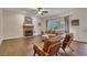 Comfortable living room with hardwood floors, fireplace, and large windows at 1772 Brittany Chase Nw, Kennesaw, GA 30152