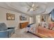Spacious main bedroom featuring a tray ceiling, tv, and art at 1772 Brittany Chase Nw, Kennesaw, GA 30152