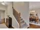 View of carpeted staircase leading to the upper level, adjacent to the dining room at 1772 Brittany Chase Nw, Kennesaw, GA 30152