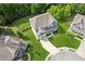 Expansive backyard and lush landscaping surround this well-maintained home in a desirable neighborhood at 1450 Rainfall Ct, Cumming, GA 30040