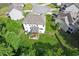 Aerial view of the home showcasing the backyard with a deck and fenced yard at 1450 Rainfall Ct, Cumming, GA 30040