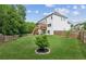 Manicured backyard featuring a privacy fence and tiered deck at 1450 Rainfall Ct, Cumming, GA 30040