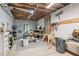 Unfinished basement with exposed ceiling featuring a work area at 1450 Rainfall Ct, Cumming, GA 30040