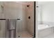 Contemporary bathroom featuring sleek glass shower, soaking tub, and modern fixtures at 1450 Rainfall Ct, Cumming, GA 30040