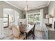 Charming dining area with natural light, stylish decor, and a view of the outdoors at 1450 Rainfall Ct, Cumming, GA 30040