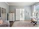 Charming dressing room with a plush chair and ample natural light from the windows at 1450 Rainfall Ct, Cumming, GA 30040