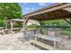 Outdoor grilling area with picnic tables available in the community at 1450 Rainfall Ct, Cumming, GA 30040
