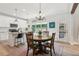 Open kitchen with granite counters, stainless appliances, and an eat-in dining area at 1450 Rainfall Ct, Cumming, GA 30040