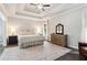 The primary bedroom is filled with natural light and features a trey ceiling and hardwood floors at 1450 Rainfall Ct, Cumming, GA 30040